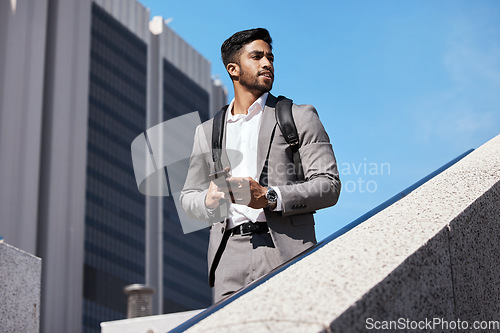 Image of Phone, city and businessman walking on stairs by building for travel while thinking. Confidence, technology and professional male employee browsing on cellphone commuting to work in urban town street