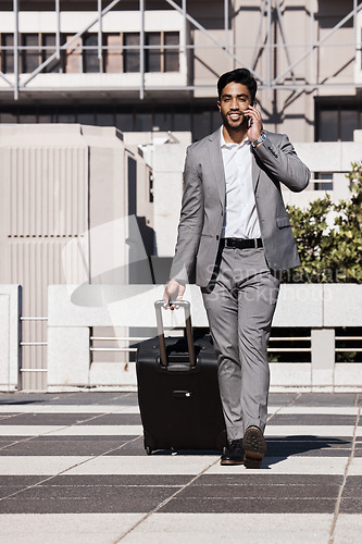 Image of Phone call, travel and luggage with a businessman walking in the city for a company trip. Mobile, communication or suitcase with a young male employee talking while on a commute outdoor in town