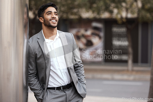 Image of Thinking, happy and a businessman in the city on a wall for ideas, planning and a vision. Smile, corporate and a man in a suit in town for ideas, a plan or professional happiness for business