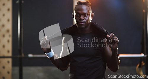 Image of Serious, bodybuilder and portrait of black man in gym for training, exercise and strong workout. Fitness, muscles and face of male person with sweat towel for challenge, wellness and body strength