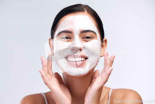 Image of Skincare, face mask and portrait of a woman in a studio for natural, cosmetic and beauty routine. Wellness, health and female model cleaning her skin with facial cleanser isolated by white background