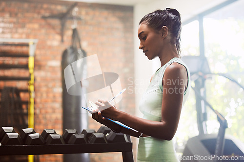 Image of Exercise, personal trainer and woman in a gym, inventory and checklist for equipment, schedule and hygiene inspection. Female person, entrepreneur or athlete with documents, feedback and training