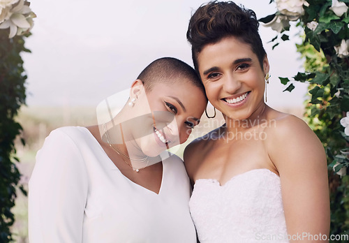 Image of Wedding, happiness and portrait of lesbian couple with smile, love and diversity in flower arch. Lgbt marriage, celebration and happy face of woman with bride at reception, lgbtq pride and commitment