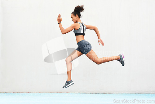 Image of Woman, fitness and running on mockup of athlete in cardio training, workout or healthy exercise. Fit, active or sporty female person or runner exercising for health and wellness on wall mock up space