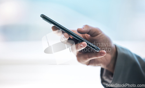 Image of Phone, hand and communication with a business person typing a text message or email on a blurred background. Mobile, contact and networking with an employee browsing social media or texting closeup