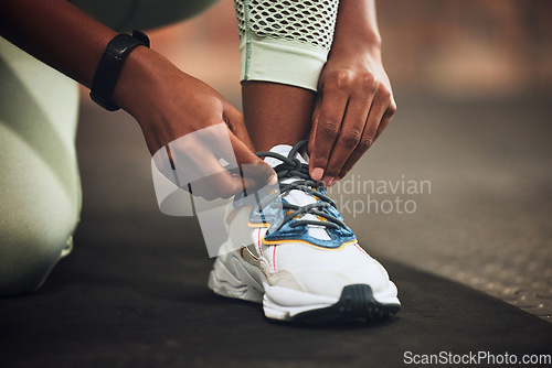 Image of Lace, gym or hands of person with shoes at gym for training, exercise or workout motivation in fitness center. Tie, closeup or legs of girl sports athlete with footwear ready to start exercising