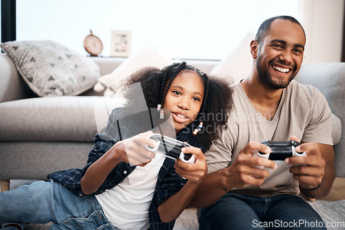 Image of Video game, family or kids with a dad and daughter in the living room of their home playing or gaming together. Children, happy or fun with a gamer father and girl child in the house to play online