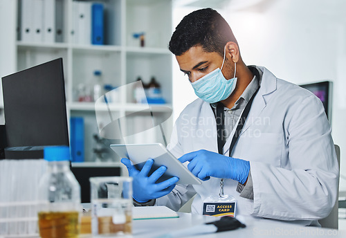 Image of Scientist man, tablet and typing in lab for medical, pharmaceutical or covid research in face mask. Young male doctor, innovation and website for test, check and science app for virus in laboratory