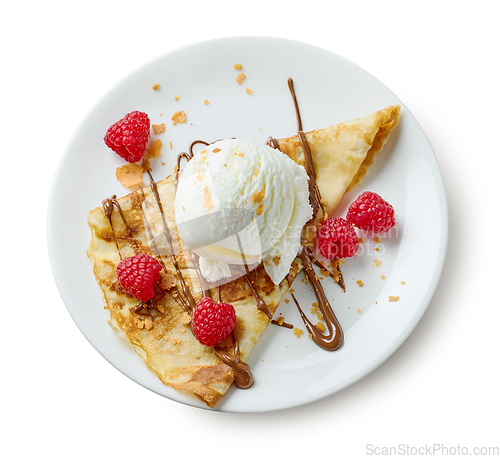 Image of plate of crepe with ice cream and raspberries