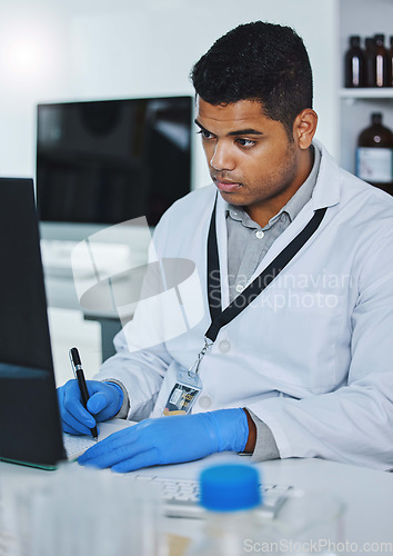 Image of Scientist man, writing and lab computer for medical notes, pharmaceutical report and research with data analysis. Young science expert, pc and paperwork for test, check and innovation in laboratory
