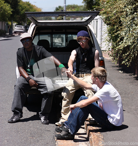 Image of Fist bump, friends or men chilling in a community together in a van on the road or sidewalk planning as a team. Gangster, outdoor and young hip hop group on the street for the urban culture