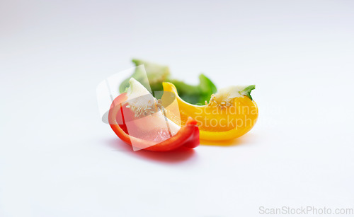 Image of Vegetable, color and healthy food in studio with peppers, art and creativity for nutritionist. Cooking, wellness diet and nutrition with clean, green or vegan meal isolated on a white background