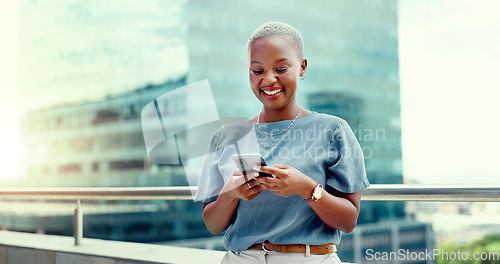 Image of Black woman, phone and city business while happy and typing online for communication. Face of entrepreneur person with urban building background while on social media, writing post or trading website