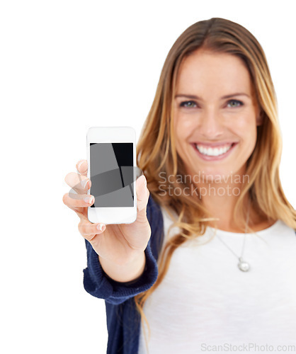 Image of Showing phone screen, happy and portrait of a woman isolated on a white background in a studio. Smile, promotion and a young lady with a mobile in hand for connectivity, communication and branding