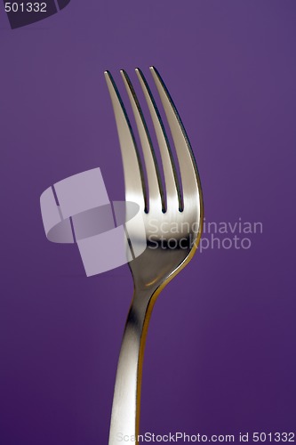 Image of a fork against red background