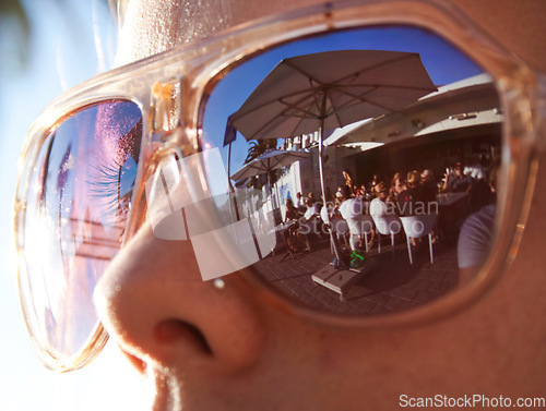 Image of Closeup, summer and woman with sunglasses, reflection and social gathering outdoor. Zoom, female person or lady with eyewear, clear vision or outside with sun flare, sunlight or traveling with shades