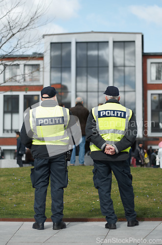 Image of Law enforcement, protection and security with police officer in city for peace, safety and authority. Emergency services, justice and guard with person in street for enforcement, order and arrest