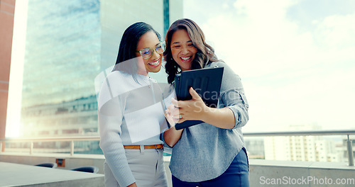 Image of Tablet, partnership teamwork and happy people on balcony review social network, customer experience or business ecommerce. Brand monitoring data, talking and women teamwork on online survey feedback