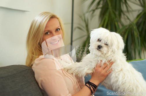 Image of Woman, poodle dog and portrait on couch with smile, hug and care together with love, bonding or comfort in home. Pet puppy, animal and happy on sofa in living room with calm, quiet and cute in house