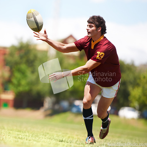 Image of Man, game and rugby on field for competition by running for fitness or exercise with energy. Male athlete, ball and workout on grass for training with development or growth in sports in the outdoors.