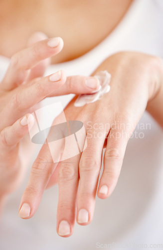 Image of Hand cream, moisturizer and woman hands closeup with beauty and skin glow from treatment. Wellness, sunscreen and skincare lotion of a female person with manicure and cosmetics application with care