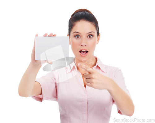 Image of Mockup, business card and surprise with portrait of woman in studio for idea, networking and space. Corporate, signage and shock with employee pointing to paper on white background for news and promo