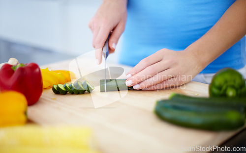 Image of Woman, hands and cutting vegetables for healthy eating, nutrition or fiber on chopping board at home. Hand of female person preparing vegetable meal for diet, organic or natural food in kitchen