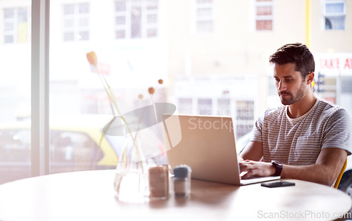 Image of Coffee shop, online and man with laptop and lens flare doing code work in a cafe. Tech, email and male freelancer customer at a restaurant with mockup and computer writing with focus on web coding