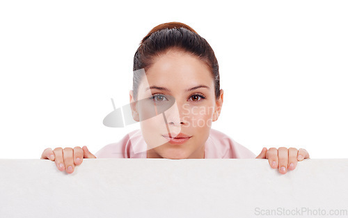 Image of Portrait, mockup poster and woman peeking over in studio isolated on a white background. Face, board and female person with copy space, advertising and marketing, commercial promotion and branding.