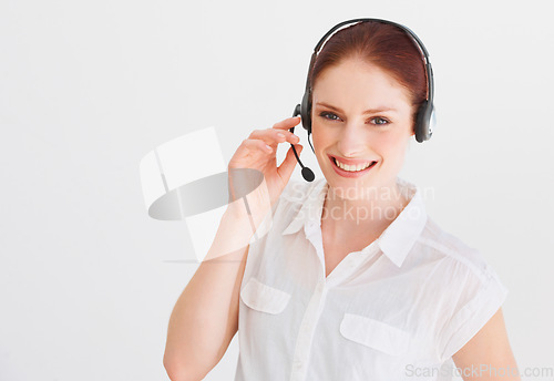 Image of Call center, smile and portrait of woman in studio for telemarketing, customer service and help desk. Happy, communication and contact us with female operator isolated on white background for mockup