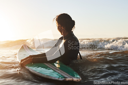 Image of Sunshine, ocean and woman surfing, fitness and exercise for wellness, balance and healthy lifestyle. Female person, surfer and girl with a surfboard, water sports and seaside for practice or sunlight