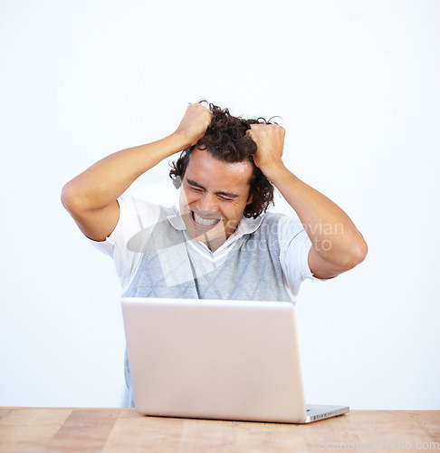 Image of Angry, laptop and businessman frustrated by glitch or error feeling stress isolated in a white studio background. Anxiety, depression and male employee with mental health issue due to a 404 problem