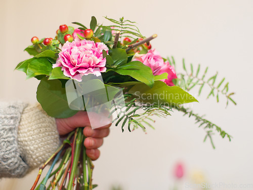 Image of Closeup, hand and woman with a bouquet, gift and care with beauty, natural and flora. Zoom, female person and girl with flowers, nature and wellness with a present, spring and blooming with blossom