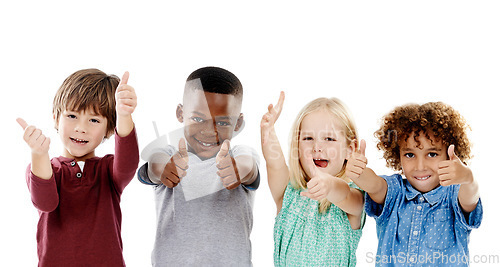 Image of Children, group and thumbs up for diversity in studio portrait with smile, agreement and white background. Girl, boy or isolated friends for happiness, hand like or solidarity for kids with kindness