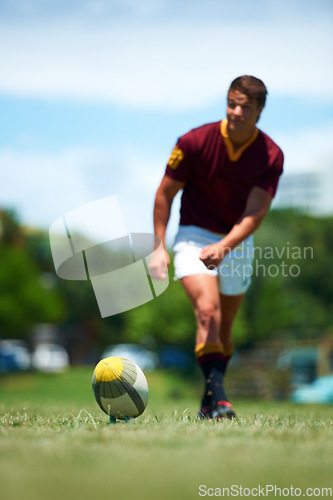 Image of Sports, young rugby player kick a ball for conversion and in a field for a game or competition. Fitness or exercise, sportsman or training and professional male athlete playing on grass pitch outdoor