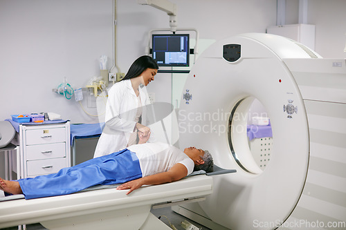 Image of Doctor, mri and woman holding hands of patient in hospital before scanning in machine. Ct scan, comfort and medical professional with senior female person in radiology test for healthcare in clinic.