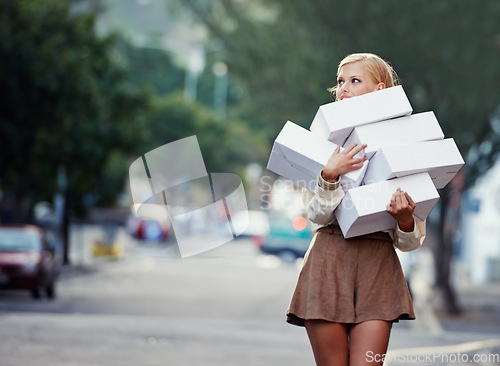 Image of Shopping boxes, city woman and walking in urban street after buying pile of store present, promotion product or market gift. Fashion box, boutique choice and female customer looking at retail mockup