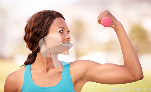 Image of African woman, dumbbell workout and outdoor with smile, strong arm muscle and focus for wellness, Girl, training and fitness in park, garden or backyard with pride, weightlifting and flex for health