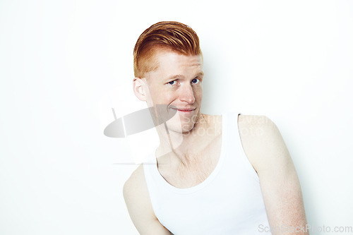 Image of Portrait, doubt and a ginger man in studio isolated on a white background wearing a tank top. Face, confused and question with a young male person indoor on mockup looking skeptical in a vest