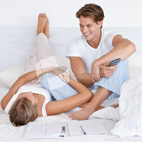 Image of Man, woman and bed with calculator, budget and planning finance for savings, investment and debt in home. Couple, tax and happiness for profit, bonus and conversation for future, goals and documents