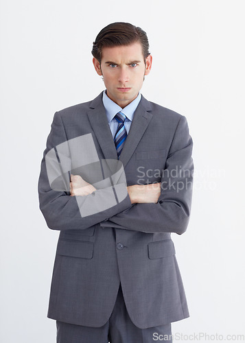 Image of Anger, crossed arms and portrait of business man on white background with upset, mad and angry expression. Employee, professional and face of male worker with stress, frustrated and annoyed in studio