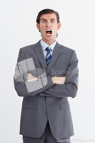 Image of Anger, shout and portrait of business man on white background with upset, shouting and angry expression. Manager, professional and male worker with stress, frustrated and crossed arms in studio