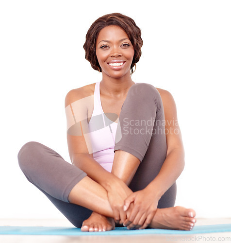 Image of Yoga, black woman and portrait in a studio with happiness from fitness and exercise. Isolated, white background and African female person on a workout mat for health and wellness feeling happy