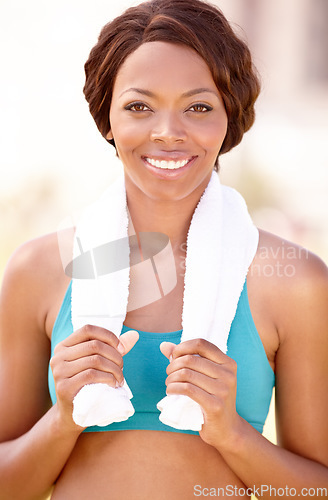 Image of Fitness towel, black woman and smile portrait with happiness from exercise and sport. Workout, African person and female face feeling healthy and happy from sports training and wellness empowerment