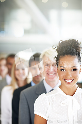 Image of Portrait, leadership and a business black woman manager at the from of a queue in her corporate office. Smile, management and a happy female leader standing in line with a team following her vision