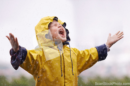 Image of Girl, playing outdoor and screaming in rain, nature and excited with winter fashion. Female child, raincoat and playful with water, open hands and happiness on adventure with freedom in childhood