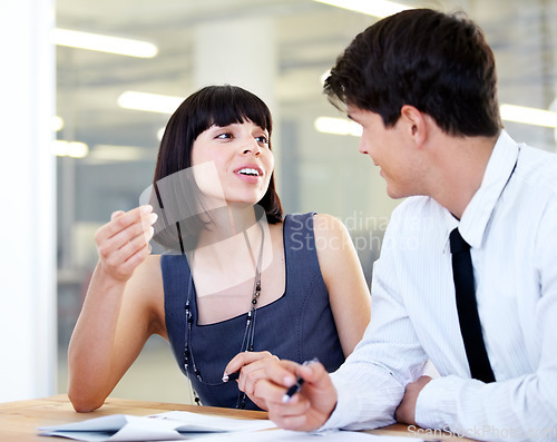 Image of Business, man and woman planning, discussion and brainstorming with advice, help and partnership. Staff, male consultant or female employee share ideas, explain document or conversation in the office