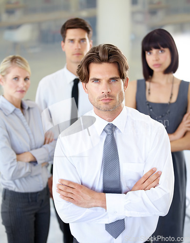 Image of Portrait, confident people with serious face and arms crossed in business office. Teamwork or collaboration, coworkers or colleagues in corporate environment and professional leadership or management