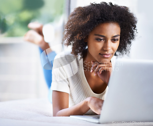 Image of Thinking, ideas and woman with a laptop, search website and blogging with thoughts, online reading and happiness. Female person, lady or model with technology, home and cheerful with wonder and email