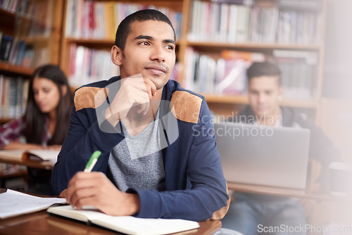 Image of Study, writing and thinking with man in library for education, research and classroom quiz. Focus, learning and notebook with male student on university campus for knowledge, scholarship and project